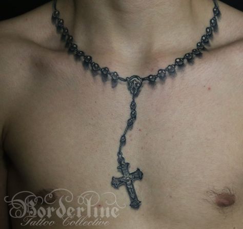 Black and grey realistic cross and rosary beads tattoo. #chest tattoo #religious #religioustattoo #chest #borderlinetattoocollective #male #jesus #rosarybeads #realistic Rosary Tattoo Around Neck, Rosary Tattoo Neck, Krunica Tattoo, Rosary Tattoo For Men Chest, Rosary Neck Tattoo, Rosery Tattoos Men, Necklace Tattoo For Men, Cross Chain Tattoo, Rosary Beads Tattoo