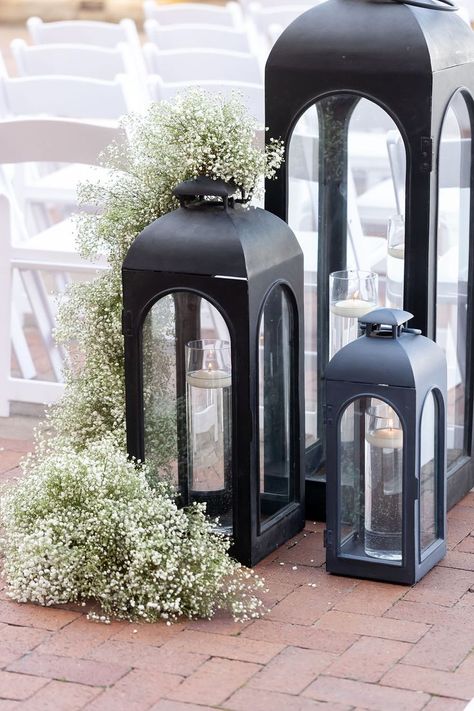 Large black lanterns, floating candles, baby's breath garlands - ceremony aisle entry Black Lantern Wedding, Lanterns Floating, Wedding Ceremony Aisle, Ceremony Decorations Outdoor, Wedding Church Decor, Black And White Wedding Theme, Wedding Isles, Ceremony Aisle, White Wedding Theme