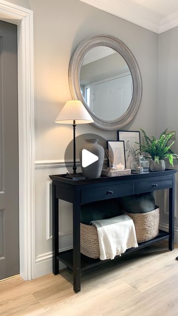 Juliette- INTERIORS on Instagram: "The entrance to our home. Love walking in to this space.  The poor fern keeps taking a battering with the wind every time the door opens.   Shop the look:   Console, coat hook and show basket @neptunehomeofficial   Lamp @thewhitecompany   Vase and console baskets @houseinteriorslive   Fern @hortology   Mirror @therangeuk   Throw and cushions @zarahome   Door paint @farrowandball moles breath   Wall paint @neptunehomeofficial driftwood and snow     #interiors #interiordesign #design #homedecor #home #architecture #decor #furniture #interiors #art #homedesign #decoration #interiordesigner #inspiration #luxury #interiorstyling #interiordecor #style  #instagood #furnituredesign #hallway #hallwayinspo #hallwaydecor #consoletable #consoletable #consoletabledeco Console Table Hallway Entrance Halls, Console Baskets, Hallway Console Table Ideas, Front Hallway Ideas Entrance, Console Decor Ideas, Hallway Console Table Decor, Moles Breath, Open Console, Front Hallway