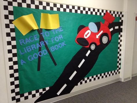 Race car library bulletin board. Race to the library for a good book. The border is 3" black squares on white construction paper. Race Track Bulletin Board, Race To The Finish Line Bulletin Board, Racetrack Bulletin Board, Race Track Bulletin Board Ideas, Race Car Classroom Theme Bulletin Boards, Racing Theme Classroom, Racing Bulletin Board Ideas, Race Car Bulletin Board Ideas, Race Car Bulletin Board