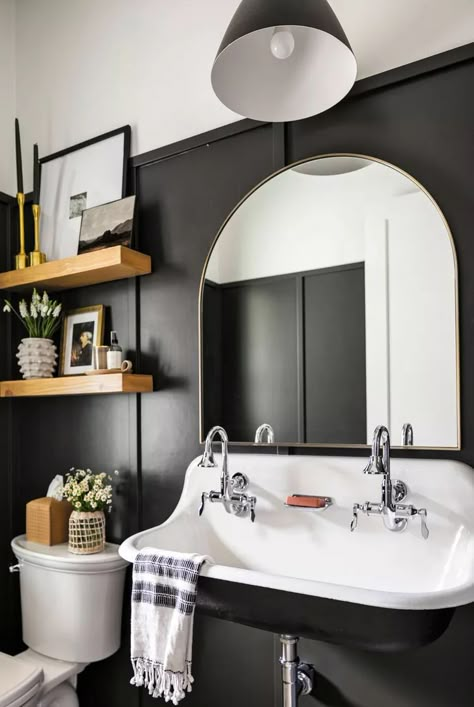 Add visual interest to bathroom walls with wainscoting painted black or another dark and moody paint color. Cover the bottom half or two-thirds of the wall with the wainscoting and use paint with a slightly glossier sheen than the wall to create distinction and to make the wall paneling easily wipeable. #bathroomdecor #bathroomideas #bathroomdesign #bathroominspiration #bhg Soothing Paint Colors, Creative Bathroom, Decorating Advice, Iron Ore, Small Space Diy, Half Bathroom, Powder Bath, Black Cabinets, Room Remodeling