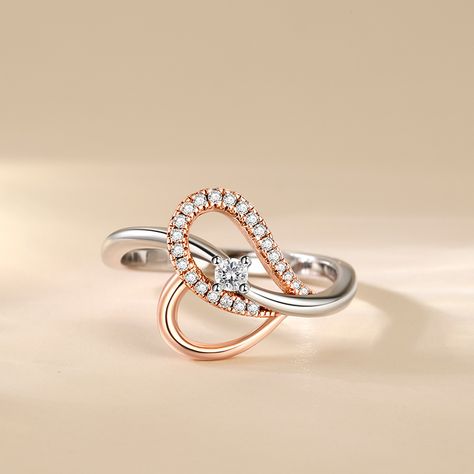 This sterling silver infinite heart ring radiates warmth with its round cut main stone as the focal point. The designer skillfully incorporates the element of infinite love to extend the power of love into eternity. The color blocking design of silver and rose gold adds style and elegance. Wearing this two tone infinite ring not only shows your protection and cherishing of love, but also highlights your noble and unique taste!Carat Weight: 0.125 ctStone Size: 2.5 mmStone Type: Jeulia® StoneNumber of Stones: 1 Stone Color: Diamond WhiteStone Shape: RoundCarat Weight: 0.212 ctStone Size: 1,0.8 mmStone Type: Jeulia® StoneNumber of Stones: 23 Stone Color: Diamond WhiteStone Shape: RoundWeight: 2.8 gWidth: 1.9 mmHeight: 4.5 mmThickness: 1.2 mmMaterial: 925 SilverPlating Color: Silver, Rose Gold Diamond Ring Designs Unique, Infinite Ring, Infinite Heart, Color Blocking Design, Fancy Diamond Ring, Infinite Love, Diamond Rings Design, Jewelry Drawing, Power Of Love