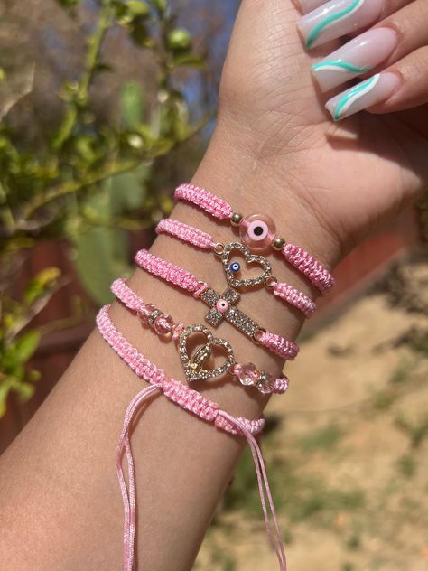 Evil Eye 🧿 Beaded Bracelet In many cultures, it is believed that evil eye bracelets protect against misfortune, evil looks and negative energy. Wear your bracelet for good luck and protection. ✨ Pink Evil eye protects your friendships and exhibits a calming, relaxing feeling. ✨ Ojo Bracelets Aesthetic, Matching Ojo Bracelets, Evil Eue Bracelets, Pink Mexican Bracelet, Evil Eye Bracelets Ideas, Mexican Evil Eye Bracelet, Cute Evil Eye Bracelet, Girly Accessories Bracelets, Pink Evil Eye Bracelets