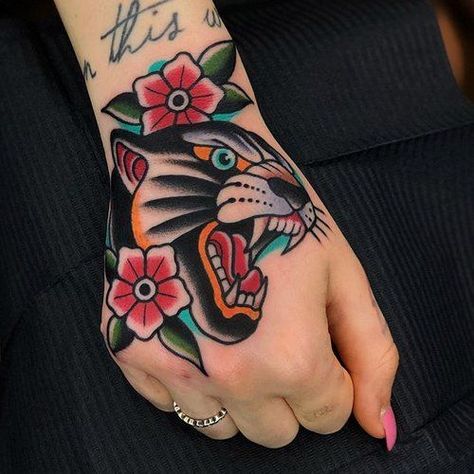 Hand tattoos are very beautiful. We have selected 50 unique female hand tattoos to browse at your perusal, whether you’re seeking inspiration for your first inking or simply looking to add to your own personal collection. The hands are one of the most popular spots to place a tattoo. The best part of having hand tattoo is that it can even add more elegance, especially for women. Panther Tattoos, Traditional Hand Tattoo, Traditional Tattoo Inspiration, Neotraditional Tattoo, Traditional Style Tattoo, Panther Tattoo, Traditional Tattoo Sleeve, Tattoos Geometric, Old School Tattoo Designs