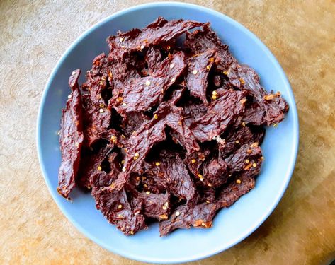 The best way to make jerky is with venison, of course! This venison jerky recipe uses fish sauce and white pepper for a savory and spicy jerky recipe you'll be making over and over! This recipe works with elk and antelope too. . . . #jerky #jerkylove #jerkytime #jerkygoldmarinade #jerkylife #jerkywagon #jerkytreats #jerkysquad #jerkyreview #jerkypro #jerkyporn #jerkylovers #jerkyingredients #jerkyflavors #jerkyaddict #venisonjerky #wildgame #wildgamerecipe #wildchef #venison Spicy Jerky Recipe, Venison Snack Sticks, Deer Jerky Recipe, Venison Jerky Recipe, Recipes Venison, Deer Jerky, Camp Recipes, Venison Jerky, Jerky Recipe