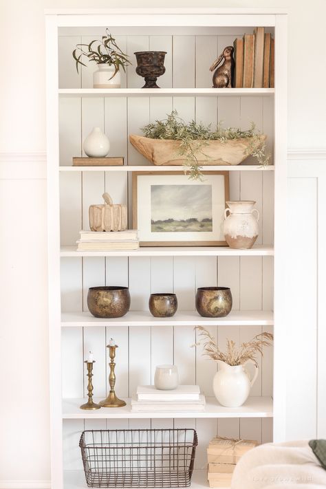 This simple, neutral look is so soft and pretty. Love this understated look for fall. #falldecor #falldecorinspo #fallshelf #fallshelfie #fallshelfdecor #fallshelfstyling #fallaccents #fallaccessories #falllivingroom #neutralfall #neutralfalldecor #neutraldecor White Book Shelf, Fall Shelf Decor, Shelf Decor Living Room, Interior Boho, Styling Shelves, Bookcase Styling, Fall Living Room, Bookcase Decor, Interior Vintage