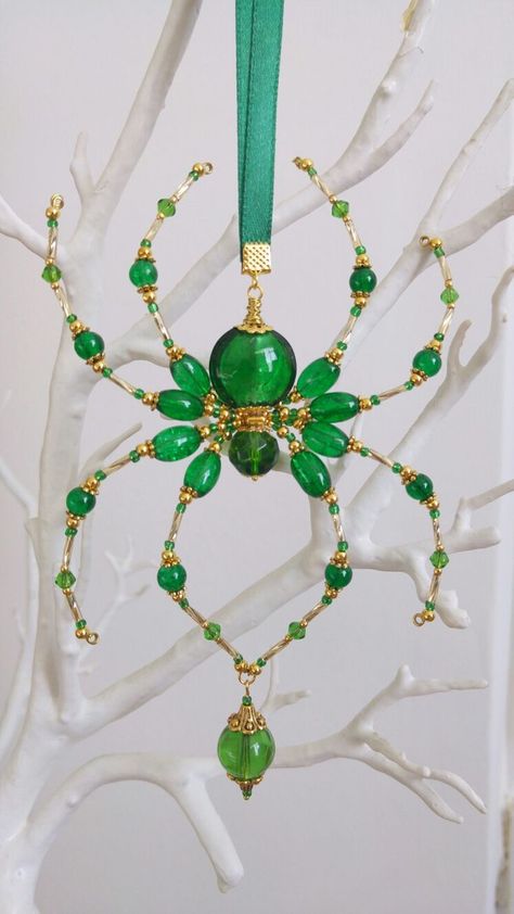 my new emerald green suncatcher SOLD | Beaded jewelry, Diy wire jewelry, Wire jewelry designs Beaded Spiders How To Make, Bead Projects Ideas, Mini Suncatchers, Green Suncatcher, Bead Spiders, Bead Bugs, Bead Spider, Beaded Insects, Christmas Spiders