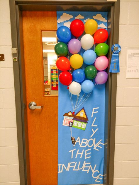 Teacher Door Decorating for red ribbon week. UP movie theme: "Fly Above the Influence." Up Movie Door Decoration, End Of The Year Classroom Doors, Back Door Decorating Ideas, Disney Teacher Door, Graduation Door Decorations Classroom, Graduation Door Ideas, Pixar Decorations Ideas, Lego Door Decorations Classroom, Graduation Classroom Door