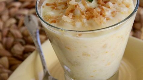 Coconut milk, pineapple, banana, and coconut are simmered together creating a tropical-flavored pudding that is perfect for summer desserts. Pina Colada Pudding, Boozy Ice Pops, Coconut Rice Pudding, Pineapple Dessert Recipes, Pina Colada Recipe, Pineapple Desserts, Homemade Pudding, Coconut Desserts, Pudding Recipe