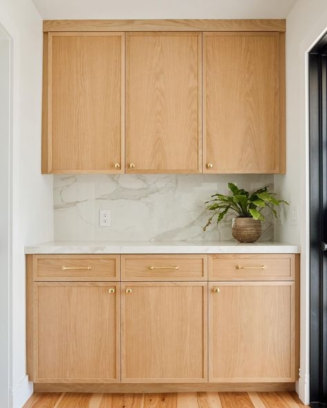 This small space between a back door and a guest bathroom might be seen as a deadzone, but these custom cabinets boost storage and counter space — perfect for placing a spread while entertaining, or brewing your morning coffee.   #custommade #customcabinetry #customcabinetslosangeles #customkitchen #whiteoakkitchen #localbusiness #ventura #805 #santabarbara #montecito #slimshakercabinets #shakercabinets #naturallight Small White Oak Kitchen, White Oak Slim Shaker Cabinets, Slab Front Cabinets, Maple Shaker Kitchen Cabinets, Kitchen Wall Covering, Slab Kitchen Cabinets, Adu Kitchen, Oak Kitchens, Slab Cabinets