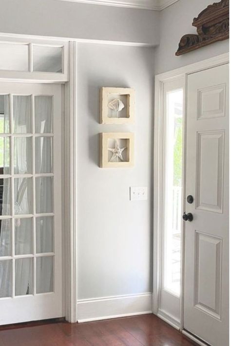 Entry walls are painted Behr Sterling (a light grey with blue undertones) and paired with white moldings - This Girl Paints. #behrsterling #lightgrey #paintcolors #greypaint Behr Tranquil Gray, Light Blue Grey Paint, Bedroom Paint Colors Grey, Grey Interior Paint, Warm Grey Paint Colors, Warm Gray Paint, Light Grey Paint Colors, Grey Walls Living Room, Blue Grey Walls