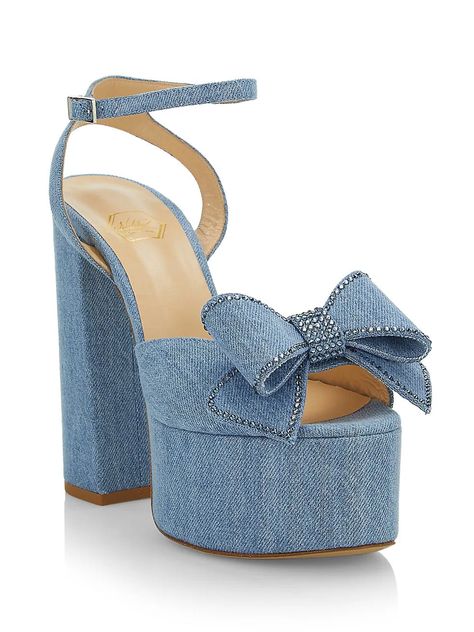 From the Reflections Collection. Crafted in Italy, Nalebe's Upendi denim platforms feature a high block heel and chunky platform design. Crafted of denim, this buckle style is finished with a bow vamp and mini crystal trim. Buckle closure Cotton upper Calf leather sole Dust bag included Hand wash Made in Italy SIZE Heel height, about 7" SIZE - RUNS TRUE TO SIZE Crystal Detail Denim Leather lining & insole Hand Finished - Each pair is handmade Luxury Denim Heels For Summer, Diesel Denim Heels, Denim Platform Heels With Open Toe, Blue Denim Platform Heels, Quince Shoes, Luxury High Heel Denim Heels, Sandals On Sale, Denim Heels, Platform Design