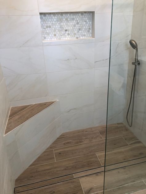 Walk In Shower Wood Floor, Gray Shower Tile With Wood Floor, Tiled Shower With Half Wall, Shower Tile Bench Ideas, Showers With Niches And Bench, Marble And Wood Look Tile Bathroom, Wood Tile Bathroom Shower Walk In, Tile Patterns For Showers, Walk In Shower With Corner Bench