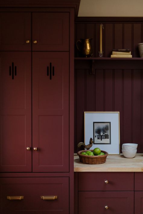 Traditional English inspired red kitchen renovation. Shaker doors with cut out detail, butcher block counter, brass cup pull, brass knobs, headboard backing Deep Red Interior, Burgundy Shaker Kitchen, Burnt Red Cabinets, Deep Red Cabinets, Wine Red Interior, Oxblood Kitchen Cabinets, Dark Burgundy Kitchen Cabinets, Red Shaker Kitchen, Burgandy Kitchen Cabinet