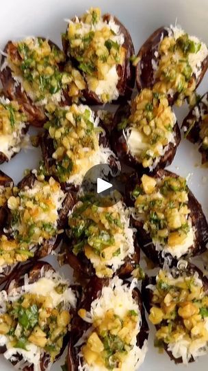 7.1K views · 135 reactions | FETA-PARMESAN ROASTED STUFFED DATES WITH HONEY-WALNUT HERB CRUNCH! •Cre by @starinfinitefood For the topping: 1/3 cup walnuts, finely chopped 1 tbsp finely chopped rosemary 2 tbsp chopped scallions 2 tbsp chopped parsley or arugula 1/2 tbsp olive oil 1/2 tbsp honey 1 tsp orange zest 1/4 tsp salt Pepper to taste • 10 oz dates, sliced open on one side Honey 3 oz feta cheese, sliced into 1 inch “pieces” 3/4 cup shredded Parmesan cheese • 1️⃣Preheat the oven to 375. 2️⃣Make the topping by adding all ingredients to a bowl and mixing. 3️⃣Add some honey to a small bowl and add the Parmesan to a small plate. Dip the feta into honey, then the Parmesan to coat. Add the feta to the center of the dates. 4️⃣Add the dates to a casserole dish. Top with topping. Bake for 15 m Feta Parmesan Roasted Stuffed Dates, Zucchini Appetizer, Stuffed Dates, Honey Walnut, Small Plate, 2023 Christmas, Orange Zest, Small Bowl, Casserole Dish