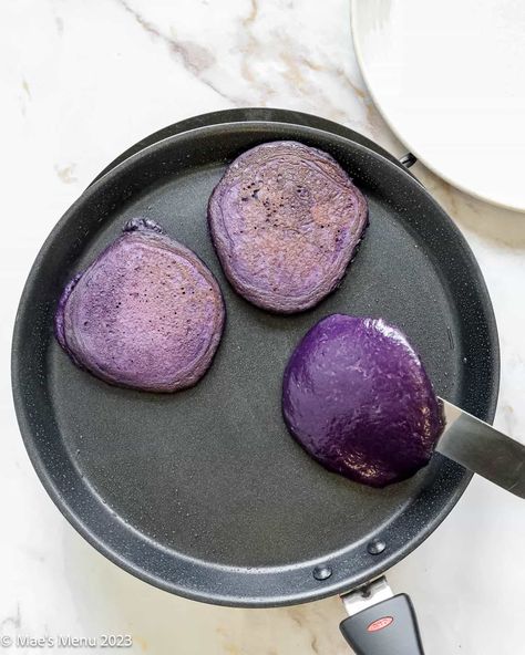 Ube pancakes bring a brilliant purple color and sweet nutty vanilla flavor to your plate or party spread. These purple pancakes are easy to make and deliver on both taste and uniqueness. Purple Pancakes, Ube Pancakes, Sweet Pancakes, Silver Dollar Pancakes, Cozy Brunch, Pancake Warmer, Pancake Toppings, Brunch Spread, Purple Food