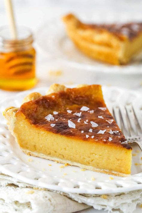 Perfectly salty and sweet, this Salted Honey Pie features a creamy custard-based filling in a classic butter pie crust. A simple classic that's absolutely scrumptious! Honey Recipes Dessert, Almond Joy Pie, Salted Honey Pie, Butter Pie Crust, Honey Dessert, Custard Pie Recipe, Honey Cake Recipe, Caramel Pie, Honey Pie