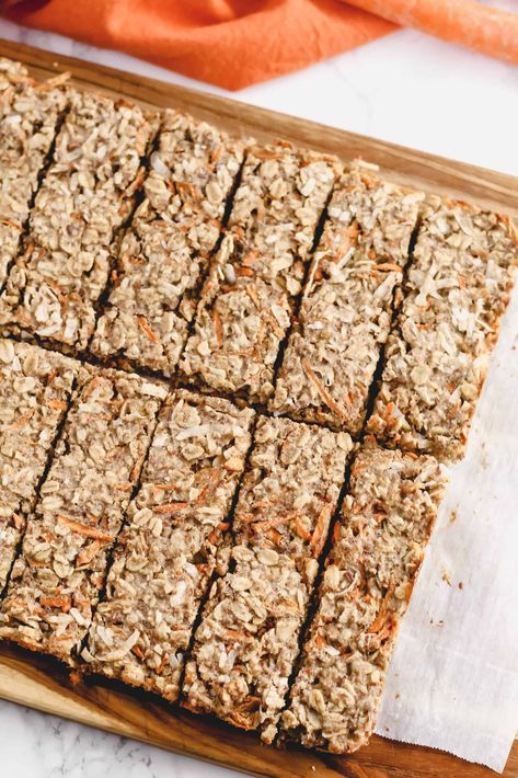 Homemade Carrot Coconut Granola Bars make a great snack to get some healthy carbs in fast and on the go. This recipe is gluten-free, dairy-free, naturally sweetened (with applesauce and honey) with an easy vegan option! These baked bars are a great way to get a little extra veggies in too, with simple carrot-cake like flavors of carrots, coconut, cinnamon and nutmeg. Carrot Cake Granola, Coconut Granola Bars, Carrot Bars, Oat Bars Healthy, Gluten Free Granola Bars, Baked Bars, Vegan Granola Bars, Maple Pecan Granola, Easy Granola Bars