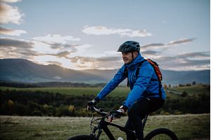 An active senior man biker riding bike in nature on autumn day. Riding Bike, Autumn Day, Bike, Nature