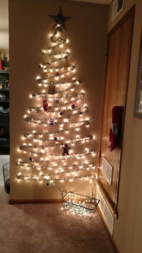 75 Simple Dollar Tree Christmas Decoration Ideas that are scintillating and lively - Hike n Dip Christmas Tree Made With Lights, Wall Christmas Tree Lights, Light Christmas Tree On Wall, Christmas Light Tree On Wall, Light Tree On Wall, Christmas Tree Out Of Lights, Christmas Light Wall, Christmas Lights Wall, Wall Mounted Christmas Tree