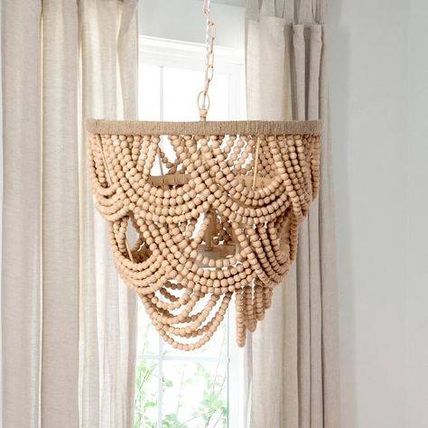 Beaded 3 light chandelier
Made of metal, jute, and mango wood
Hardwired installation
72" Chain, canopy included
E12 Socket
20" diameter x 20" tall
Made in India Organic Chandelier, Draped Ceiling, Wood Beaded Chandelier, Bead Chandelier, Wood Bead Chandelier, Fish Lamp, Cottage Home Decor, Dining Room Entryway, Mirror Sign