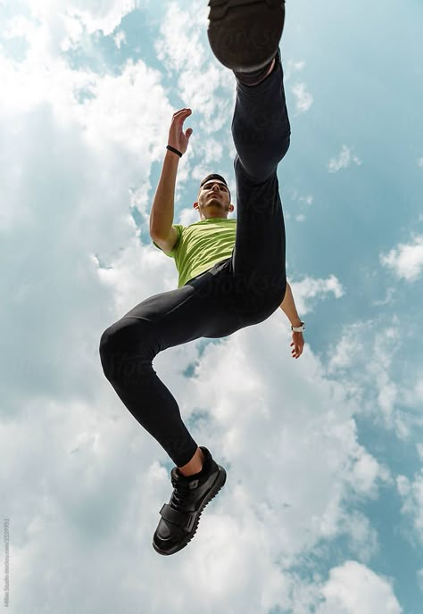 From Below Of Jumping Sportsman Under Blue Sky | Stocksy United Photography From Below, Poses From Below, Perspective From Below, Running Photoshoot, Jumping Photography, Jump Photography, Jumping Pictures, Jumping Poses, Gesture Drawing Poses