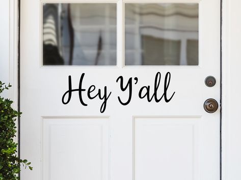 Front door decal that says, ‘Hey Ya’ll’ in a cursive font on a front porch door. Front Door Decals, Laundry Decal, Wall Decals Laundry, Laundry Room Decal, Christian Wall Decals, Front Door Decal, Bathroom Wall Stickers, Front Door Sign, Bathroom Rules