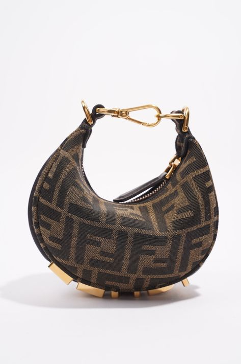 Brand: Fendi Style: Fendigraphy Bag Size: Nano Width: 15.5cm Height: 9.5m Depth: 4.5cm Handle Drop: 8cm Exterior Condition: Excellent Interior Condition: ﻿Excellent Exterior Colour: Monogram Interior Colour: Black Hardware Colour: Gold Material: Canvas Serial Code: 7AS089 ANSQ 238.0189 Manufactured In: Italy Comes With: Original Box & Original Dustbag Expensive Bag, Interior Colour, Bottega Veneta Shoulder Bag, Hermes Bags, Carry All Bag, Black Hardware, Fendi Bags, Handbag Backpack, Monogram Canvas