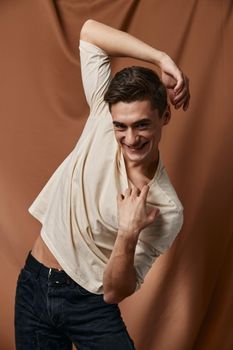 cheerful man fashionable hairstyle hands over head posing emotions fabric background #Ad , #advertisement, #posing, #emotions, #fabric, #background Hold His Hand, Charity Logo, Charity Logos, Fabric Background, Yay Images, Anatomy Reference, White Sweater, Model Release, His Hands