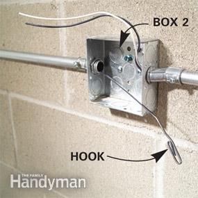 Install Surface Mounted Wiring and Electric Conduit | Family Handyman | The Family Handyman Light Switch Wiring, Basic Electrical Wiring, Small Bathroom Diy, Home Electrical Wiring, Easy Diy Hacks, Construction Diy, Electrical Projects, Diy Electrical, Electronics Projects Diy