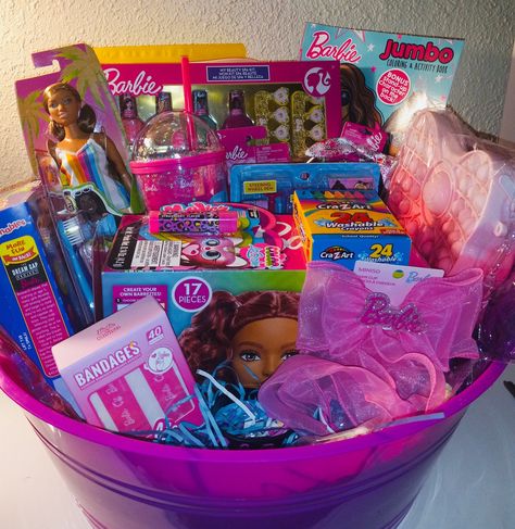 The perfect creation basket for a Barbie girl. Fabulous gift for a young lady age 4 to 12 years old. Great for a birthday gift, Christmas gift, or a special present. This gift basket has a little bit of everything for a little girl and something that will put a huge smile on their faces.  Includes: 23 items  Barbie Styling Head with 17 Accessories      Barbie Design Activity Convertible  Barbie Doll                                                          Luv Her Barbie Headband 4pc  Barbie Activity Set                                            Barbie Tumbler Cup Barbie Coloring Book                                       Large Pop Fidget Purse Barbie Fruit Snacks                                           Pink Heart Sunglasses  Barbie Toothbrushes                                        Bar Barbie Theme Gift Basket, Barbie Gift Basket, Barbie Easter Basket, Barbie Headband, Barbie Tumbler, Barbie Styling Head, Barbie Design, Candy Themed Party, Kids Gift Baskets