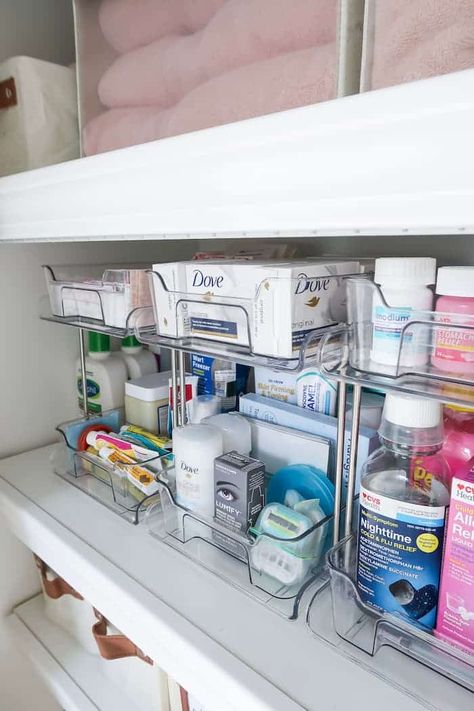 Maximize your linen closet storage space, how to use the top shelf, neutral organizers, and 13 ideas for organizing the linen closet. Linen Cleaning Closet Organization, Linen Closet In Bedroom, Deep Linen Closet Makeover, Organizing Ideas For Bathroom Closet, Linen Closet Medicine Organization, Bathroom Linen Closet Organization Master Bath, Open Hallway Linen Closet Ideas, Bathroom Organization Toothbrush, Linen Closet Design Layout