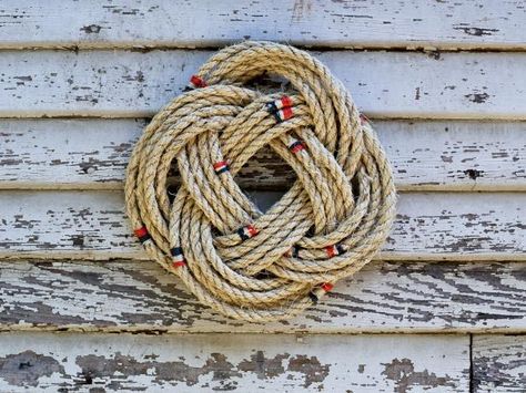 The handmade experts at HGTV.com share easy step-by-step instructions on how to tie a nautical-themed rope wreath. Nautical Rope Wreath, Diy Rope Design, Yarn Ball Wreath, Rope Wreath Diy, Rope Wreath, Rope Projects, Nautical Wreath, Nautical Crafts, Rope Diy