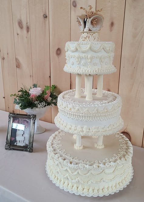 I was asked to recreate a grandparents wedding cake with frosted pillars Wilton Wedding Cakes Vintage, Wedding Cake Columns, Wedding Cake With Pillars And Flowers, 3 Tier Wedding Cake With Pillars, Traditional Tiered Wedding Cake, Tiered Wedding Cake With Pillars, Wedding Cakes Old Fashioned, Vintage Wedding Cake With Pillars, Wedding Cake Pillars