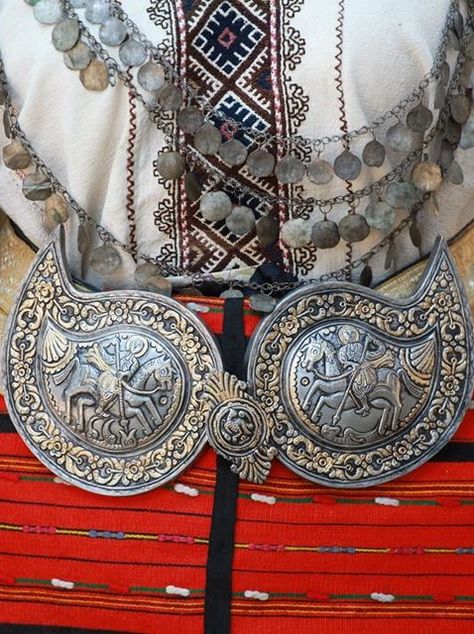 Bulgarian folk costume, a woman's belt ornaments - notice the images of St George on both halves of the ornament. St. George's Day (6th of May) is a very important traditional Bulgarian holiday Bulgarian National Costume, Bulgarian Culture, Bulgarian Folklore, Folklore Fashion, Ladies Belt, Bulgarian Clothing, Ethno Style, National Dress, National Costume