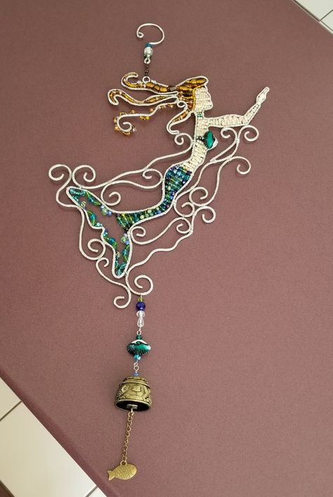 Wirewrapped beaded mermaid suncatcher windchime Mermaid Suncatcher, Wire People, Light Catchers, Horseshoe Crafts Projects, Wind Chimes Craft, Beaded Mermaid, Horseshoe Crafts, Mermaid Decor, Wire Jewelry Designs