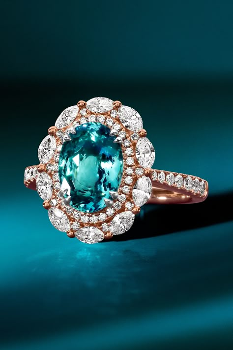 As enchanting as the ocean is the rare Neon Blue Paraiba Tourmaline. 🌊 This couture ring is embraced with a modern halo of Vanilla Diamonds, creating a pristine design blending aquatic and modern inspirations. 🧜‍♀️ #tourmaline #ocean #mermaid #couture #jewelry #diamonds Paraiba Tourmaline Jewelry, Mermaid Couture, Paraiba Tourmaline Ring, Ocean Mermaid, Beautiful Gemstones, Graphic Ideas, Jewelry Diamonds, Vintage Sapphire, Chocolate Diamonds