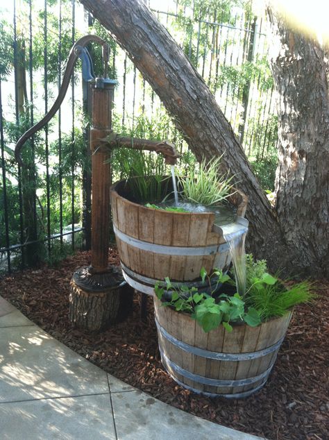 We took an old water pump and 2 half wine barrels to create this cool rustic fountain! Old Water Pumps, Barrel Fountain, Garden Water Fountains, Garden Water Feature, Diy Garden Fountains, Diy Fountain, Backyard Water Feature, Wine Barrels, Small Backyard Gardens