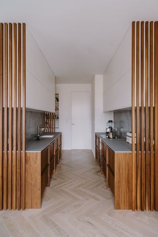 Kitchen Island Partition, Wood Panels In Kitchen, Small U Kitchen Layout, Vertical Slats Kitchen Island, Peninsula Island, Two Kitchen Islands Layout, Wood Slat Peninsula, Wooden Slat Kitchen Island, Kitchen Island Slatted Wood