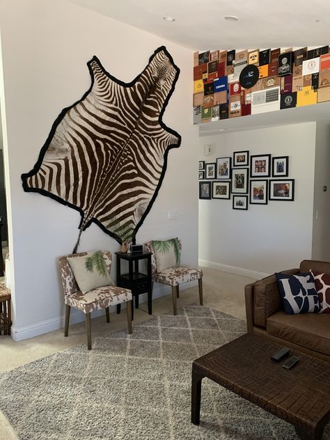 Rug On Wall, Eclectic Family Room, Zebra Rugs, African Decor Living Room, Zebra Skin Rug, Mil Suite, Victorian Office, British West Indies Style, Bear Skin Rug