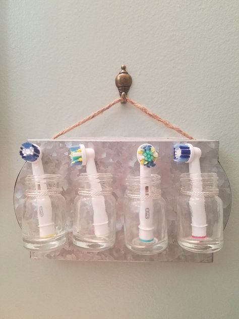 Toothbrush head holder, farmhouse style. Couldn't find one to buy so I made one! Punch holes in galvanized metal and tie bottles on with silver jewelry wire. All supplies are from Michael's. Toothbrush Head Holder, Diy Toothbrush, Electric Toothbrush Holder, Popsicle Crafts, Baby Bathroom, Physical Appearance, Teeth Health, Under Sink Organization, Best Teeth Whitening