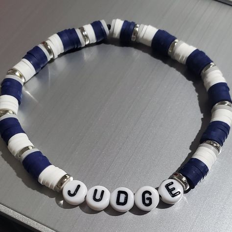 This Is A Judge Beaded Bracelet In The Yankee Colors Blue & White And Silver Spacers. A Fun Bracelet To Wear Alone Or Stacking With Other Bracelets. These Bracelets Are Made With A Sturdy Elastic Cord Available In Multiple Sizes. Unisex Bracelets Size Guide: 5” - Kids 6” - Small 7” - Average Adult 8” - Large Thank You For Visiting My Store. Bracelets For Boys, Beaded Tutorials, Clay Bead Jewelry, Bracelets Inspiration, Boys Bracelets, White Beads Bracelet, Fun Bracelet, Diy Jewelry Unique, Clay Bracelet