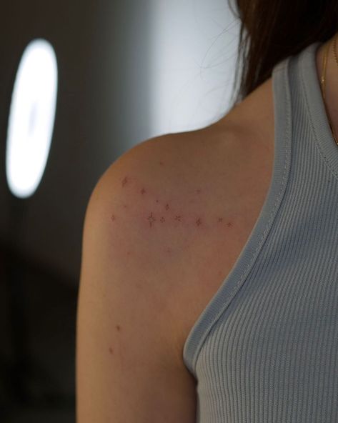 Small Stars On Shoulder Tattoo, Stars On The Shoulder Tattoo, Stars Tattoo Back Shoulder, Tiny Tattoos On Shoulder, Small Star Tattoos On Shoulder, Tattoo Sagittarius Constellation, December Constellation Tattoo, Brown Star Freckle Tattoo, Tiny Stars Tattoo Shoulder