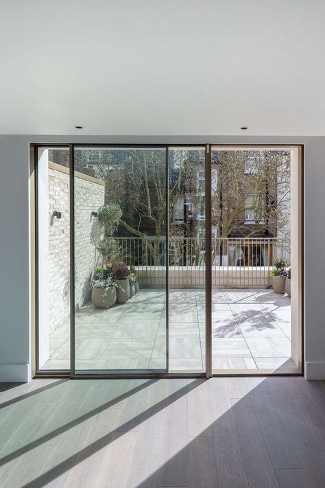 slim sliding glass door with gold frame in London Sliding Door To Balcony, Balcony Slider Door, Sliding Door Terrace, Slide Balcony Door, Triple Glass Sliding Door, Slim Frame Sliding Patio Doors, Exterior Sliding Glass Doors, Window Frame Colours, Aluminium Sliding Doors Balcony