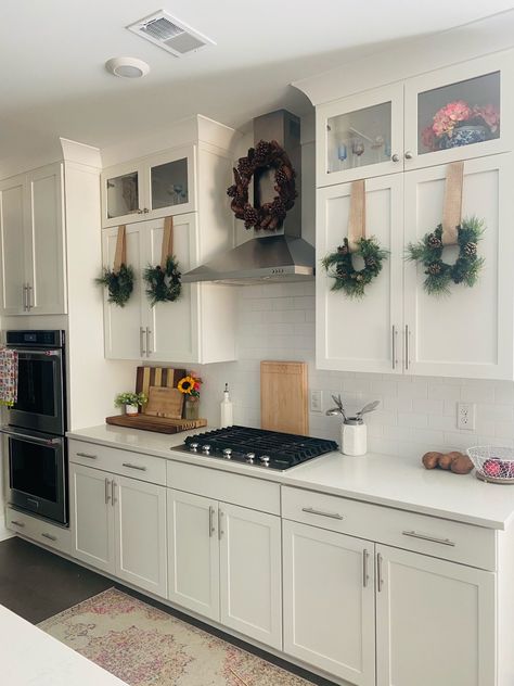 DIY Kitchen Cabinet Christmas Wreaths Christmas Wreaths Kitchen Cabinets, Christmas Wreath Kitchen Cabinets, Christmas Wreaths On Cabinet Doors, Wreath Kitchen Cabinet, Kitchen Christmas Wreath, Christmas Ribbon On Kitchen Cabinets, Christmas Wreaths On Kitchen Cabinets, Christmas Wreaths Hanging, Christmas Cabinets