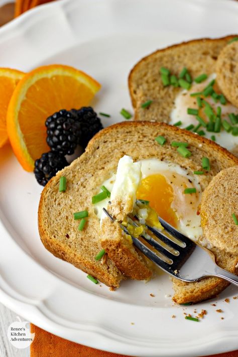 Baked Eggs in a Basket  by Renee's Kitchen Adventures - Baked Eggs in a Basket aka Eggs in a Hole, are the perfect breakfast or brunch solution for a crowd. An egg is nestled in the middle of a piece of toast and baked to perfection right in the oven! #RKArecipes Egg In A Hole, Homemade Frappuccino, Coconut Milk Smoothie, Healthy Fruit Salad, Eggs In A Basket, Berry Smoothie Recipe, Frappuccino Recipe, Summer Smoothies, Grilled Fruit