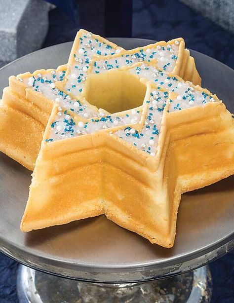 This festive and scrumptious Star of David Coconut Pound Cake serves as a beautiful centerpiece at a tea party celebrating Hanukkah. Celebrating Hanukkah, Coconut Pound Cake, Winter Season Quotes, Hanukkah Cake, Coconut Pound Cakes, Heather Stillufsen, December Winter, Season Quotes, Sweet Treats Desserts