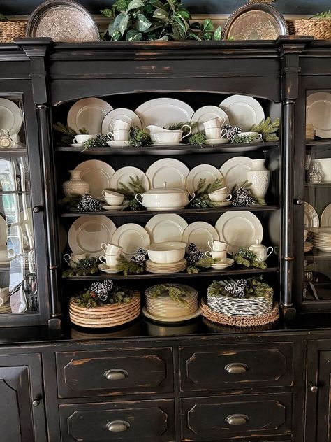 Looking for ways to arrange a china cabinet and hutch? Wait until you see how to decorate shelves with an uncluttered cozy look. I get it.Styling a china cabinet and hutch is not easy and a little intimidating.To be forthright, I struggled with this cabinet for years. I had a red spode collection that wasn How To Display Fine China In Cabinet, China Cabinet Dish Display, How To Organize China Cabinet, Styling China Cabinet Display, Organize China Cabinet, Display China In Cabinet, Display China Ideas, Displaying China In Cabinet, How To Decorate A China Cabinet