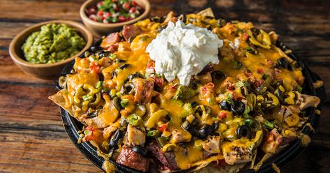 Ultimate Loaded Nachos Loaded Nachos Recipe, Bbq Nachos, Best Superbowl Food, Pulled Pork Leftover Recipes, Traeger Grill Recipes, Pulled Pork Leftovers, Loaded Nachos, Pellet Grill Recipes, Traeger Recipes