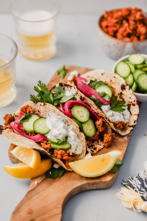 These easy-to-make Harissa Lamb Tacos are perfect for busy weeknights OR for entertaining. Make them tongiht and top them with a creamy yogurt-feta sauce, quick pickled onions, crunchy cucumbers and fresh herbs! | from Lauren Grant of Zestful Kitchen #harissarecipes #lambrecipes #tacosrecipes Lamb Tacos Recipes, Harissa Lamb, Lamb Tacos, Healthy Burrito, Feta Sauce, Lamb Taco, Harissa Recipes, Tacos Mexicanos, Quick Pickled Onions